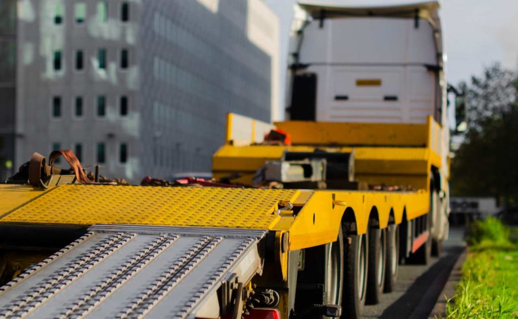 view of the back of a yellow truck trailer