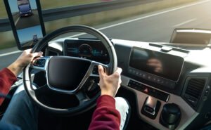 Close up photograph of the steering wheel of a large truck